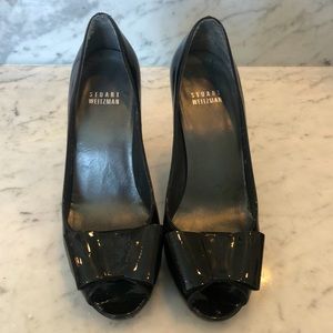Stuart Weitzman black patented leather heels.